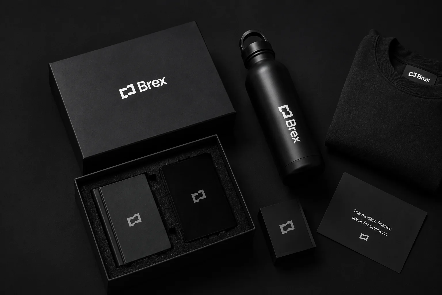 Brex gift set by Better Swag: black box, bottle, tee and cards on a dark ground
